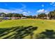Expansive putting green with homes in the background at 815 Forest Breeze Path, Leesburg, FL 34748