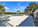 Inviting community pool with lounge chairs and shaded seating area at 815 Forest Breeze Path, Leesburg, FL 34748