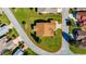 Aerial view of a single-Gathering home with a spacious lawn and surrounding neighborhood at 815 Forest Breeze Path, Leesburg, FL 34748