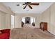 Living room with a view of a fireplace and access to other rooms at 815 Forest Breeze Path, Leesburg, FL 34748