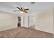 Bedroom with ceiling fan and access to bathroom and other rooms at 815 Forest Breeze Path, Leesburg, FL 34748