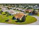 Aerial view of a house on a cul-de-sac in a residential area at 815 Forest Breeze Path, Leesburg, FL 34748