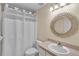 Bathroom with a vanity, toilet, shower, and decorative mirror at 815 Forest Breeze Path, Leesburg, FL 34748