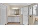 Main bathroom with double vanity and large shower at 815 Forest Breeze Path, Leesburg, FL 34748