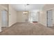 Large living room with carpeted floors and lots of natural light at 815 Forest Breeze Path, Leesburg, FL 34748