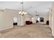 Open concept living room with a view into the kitchen and Gathering room at 815 Forest Breeze Path, Leesburg, FL 34748