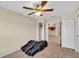 Bedroom with ceiling fan and access to other rooms at 815 Forest Breeze Path, Leesburg, FL 34748