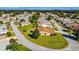 An aerial view showcasing a house's location within a residential community at 815 Forest Breeze Path, Leesburg, FL 34748