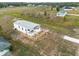 Aerial view of the property showing home and surrounding land at 25013 Van Buren St, Astatula, FL 34705