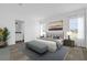 Spacious main bedroom with a plush bed and en-suite bathroom access at 25013 Van Buren St, Astatula, FL 34705