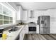 Modern kitchen featuring stainless steel appliances and light wood countertops at 25013 Van Buren St, Astatula, FL 34705