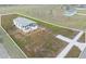 Aerial view of a single-wide home on a large lot at 25013 Van Buren St, Astatula, FL 34705