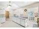 Kitchen with white cabinets, a skylight, and a breakfast nook at 2411 Greenlaw Ct, Leesburg, FL 34788