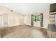 Open living room with vaulted ceilings and wood-look flooring at 2411 Greenlaw Ct, Leesburg, FL 34788