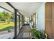Relaxing screened porch with access to backyard at 2411 Greenlaw Ct, Leesburg, FL 34788