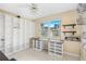 Bright home office features built-in shelving and a large window at 2411 Greenlaw Ct, Leesburg, FL 34788