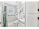 Updated bathroom with walk-in shower and grab bars at 2411 Greenlaw Ct, Leesburg, FL 34788