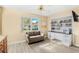 Home office with built-in shelving and a large workspace at 2411 Greenlaw Ct, Leesburg, FL 34788
