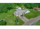 Aerial view of house with driveway and detached garage at 36849 Hilltop Dr, Fruitland Park, FL 34731