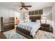 Bright bedroom with wood bed frame and en-suite bathroom access at 3358 Quail Hollow Ct, The Villages, FL 32163