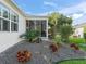 Landscaped yard with gravel, rock, and tropical plants at 3358 Quail Hollow Ct, The Villages, FL 32163
