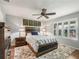 Cozy bedroom with wood bed frame and plenty of natural light at 3358 Quail Hollow Ct, The Villages, FL 32163