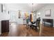 Bright dining area with hardwood floors and a glass-top table at 3358 Quail Hollow Ct, The Villages, FL 32163