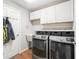 Laundry room with washer, dryer, cabinets and utility sink at 3358 Quail Hollow Ct, The Villages, FL 32163
