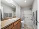 Bathroom with tub, shower, and wood vanity at 3358 Quail Hollow Ct, The Villages, FL 32163