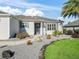 Well-maintained house with a landscaped front yard, walkway, and gravel at 3358 Quail Hollow Ct, The Villages, FL 32163