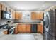 Kitchen with light wood cabinets, stainless steel appliances, and granite countertops at 3358 Quail Hollow Ct, The Villages, FL 32163