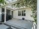 Covered patio with pergola, two grills, and a stone floor at 3358 Quail Hollow Ct, The Villages, FL 32163