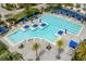 Community lap pool with surrounding lounge area at 10156 Ballast Dr, Orlando, FL 32827