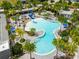 Relaxing freeform pool with palm trees and lounge chairs at 10156 Ballast Dr, Orlando, FL 32827