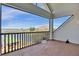 Peaceful balcony overlooking the water and trees at 17601 Sawgrass Run, Tavares, FL 32778