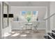 Bright breakfast nook with skylights and seating for four at 17601 Sawgrass Run, Tavares, FL 32778
