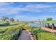 Brick pathway leads to private dock on the lake at 17601 Sawgrass Run, Tavares, FL 32778