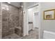 Large bathroom with walk-in shower and tiled floor at 17601 Sawgrass Run, Tavares, FL 32778