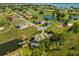 Luxury waterfront home with a golf course view at 17601 Sawgrass Run, Tavares, FL 32778