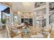 Spacious living area with fireplace and water views at 17601 Sawgrass Run, Tavares, FL 32778