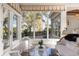 Living area with white furniture and a view of the water at 17601 Sawgrass Run, Tavares, FL 32778