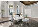 Spacious living room with white sofa and marble floors at 17601 Sawgrass Run, Tavares, FL 32778
