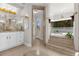 Bright bathroom with a large soaking tub and walk-in shower at 17601 Sawgrass Run, Tavares, FL 32778