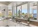 Modern kitchen with granite countertops and lake views at 17601 Sawgrass Run, Tavares, FL 32778