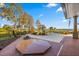 Relaxing pool area with hot tub overlooking lake at 17601 Sawgrass Run, Tavares, FL 32778