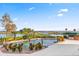 Stunning pool with a picturesque lake view at 17601 Sawgrass Run, Tavares, FL 32778