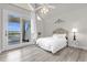 Cozy bedroom with water view and private balcony at 17601 Sawgrass Run, Tavares, FL 32778