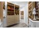 Large walk-in closet with ample shelving and drawers at 17601 Sawgrass Run, Tavares, FL 32778