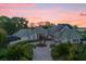 Luxury home with circular driveway and solar panels at 17601 Sawgrass Run, Tavares, FL 32778