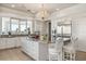 Spacious kitchen with island, stainless steel appliances, and granite countertops at 17601 Sawgrass Run, Tavares, FL 32778